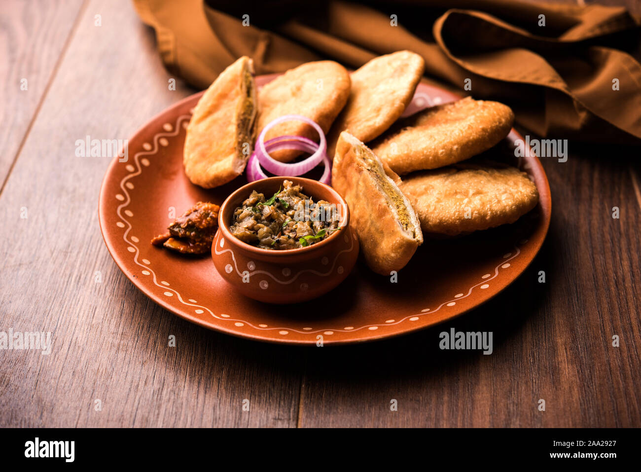 Fried Sattu Litti chokha served with Baingan Bharta, onion and pickle