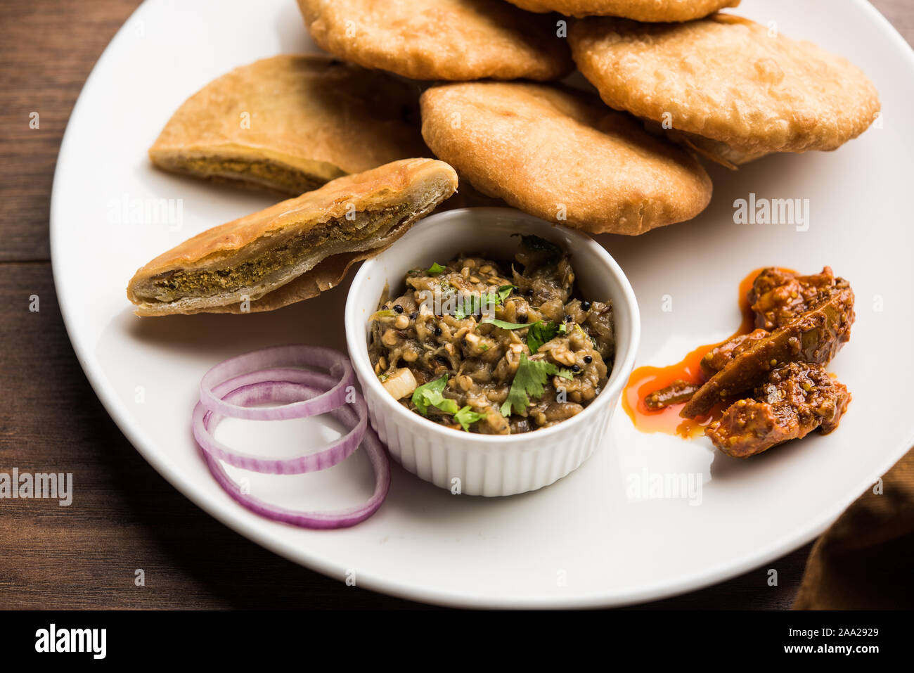 Fried Sattu Litti chokha served with Baingan Bharta, onion and pickle
