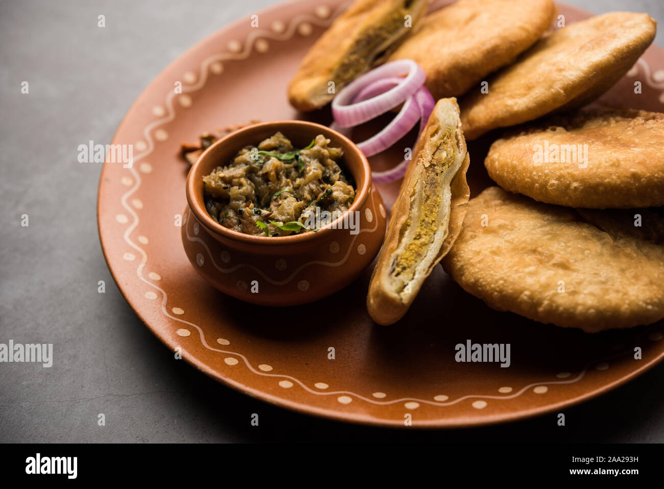 Fried Sattu Litti chokha served with Baingan Bharta, onion and pickle