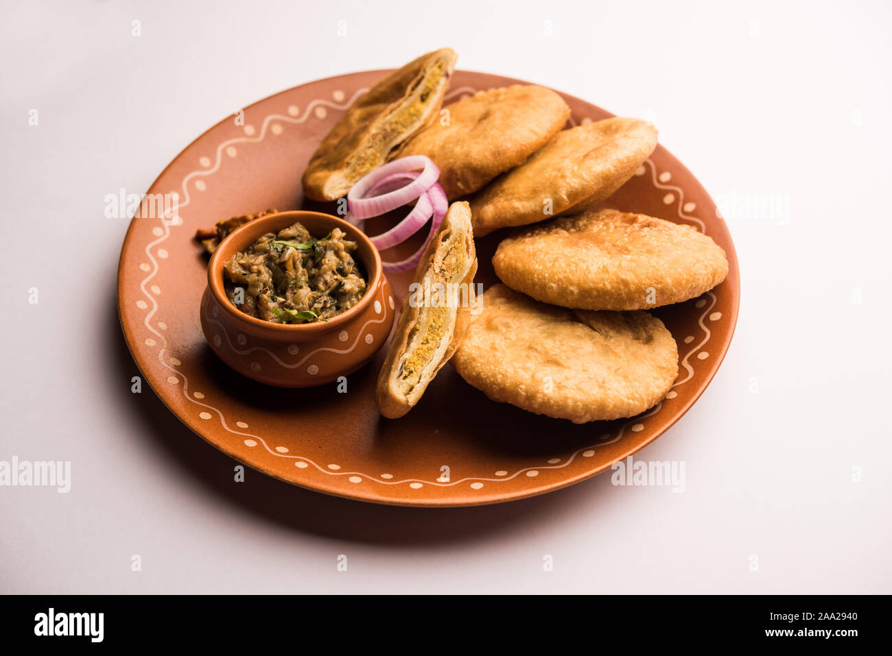 Fried Sattu Litti chokha served with Baingan Bharta, onion and pickle