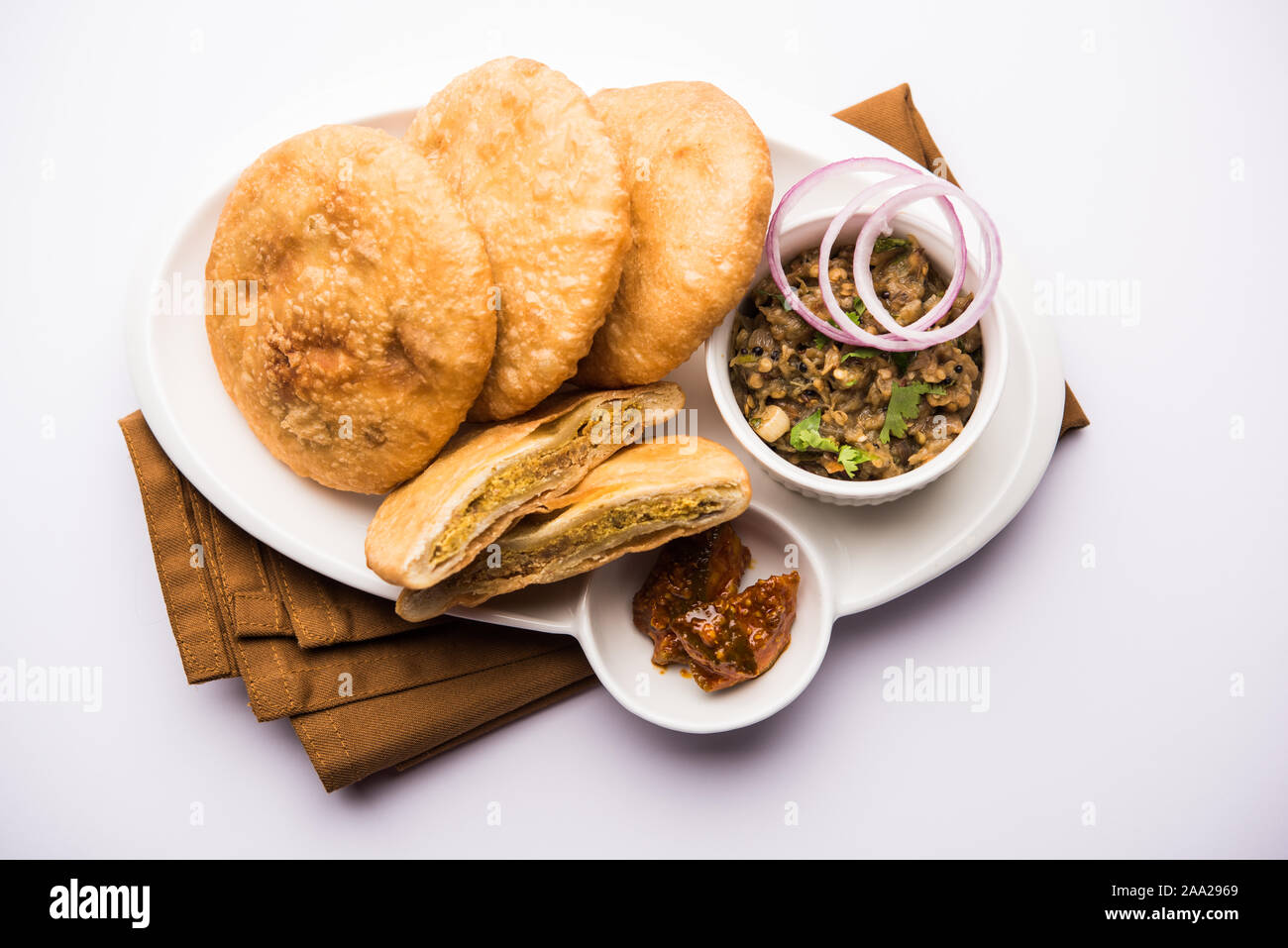 Fried Sattu Litti chokha served with Baingan Bharta, onion and pickle