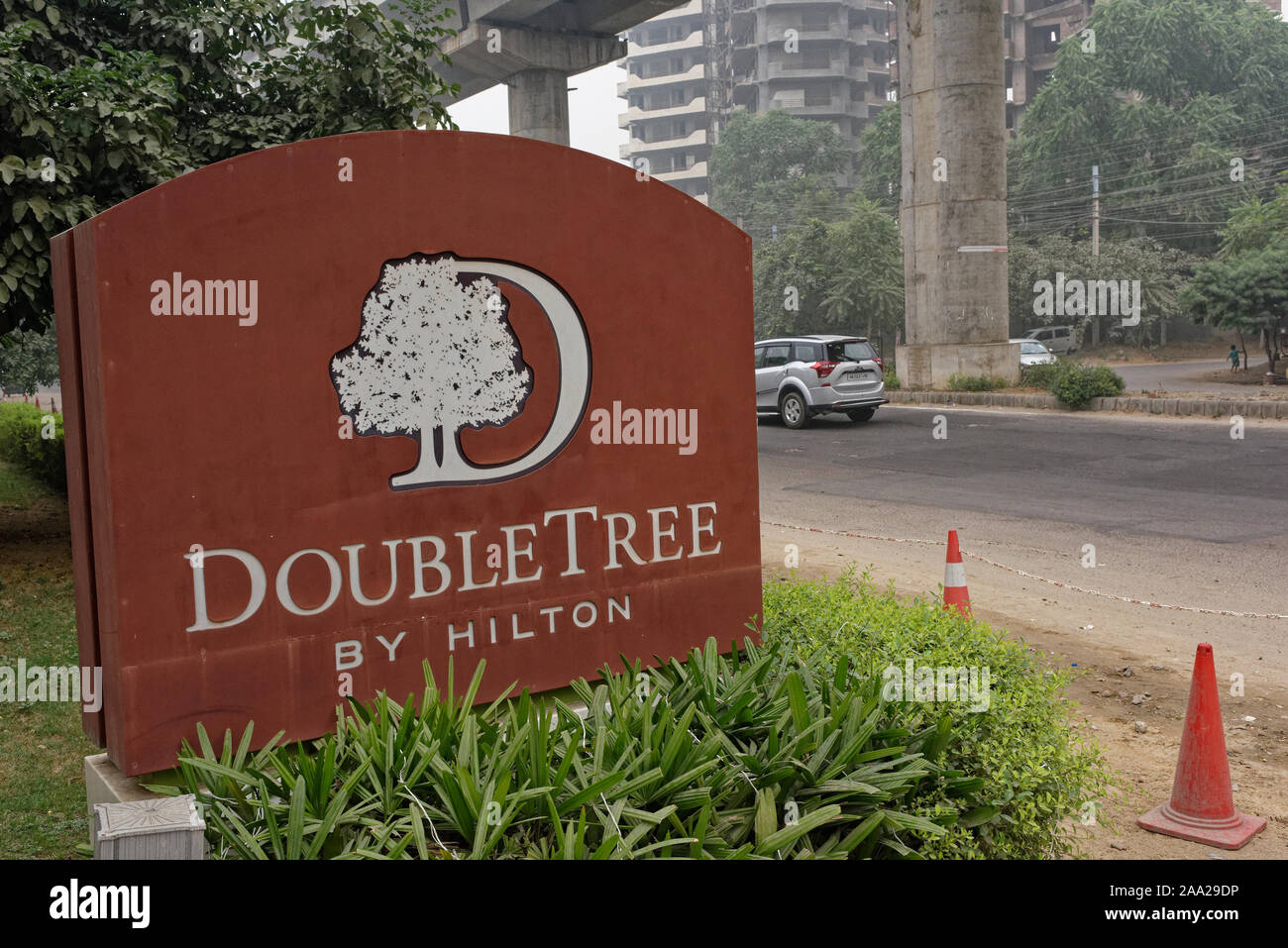 Entry sign for the Hilton Doubletree hotel in Gurgaon, Haryana, close to Delhi and the rapid metro Stock Photo