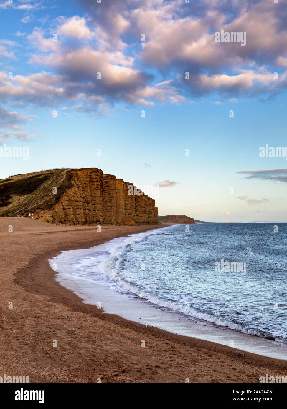 East Cliff at twilight West Bay, Dorset, England, UK. The area is part of the Jurassic Coast, a World Heritage Site. Stock Photo