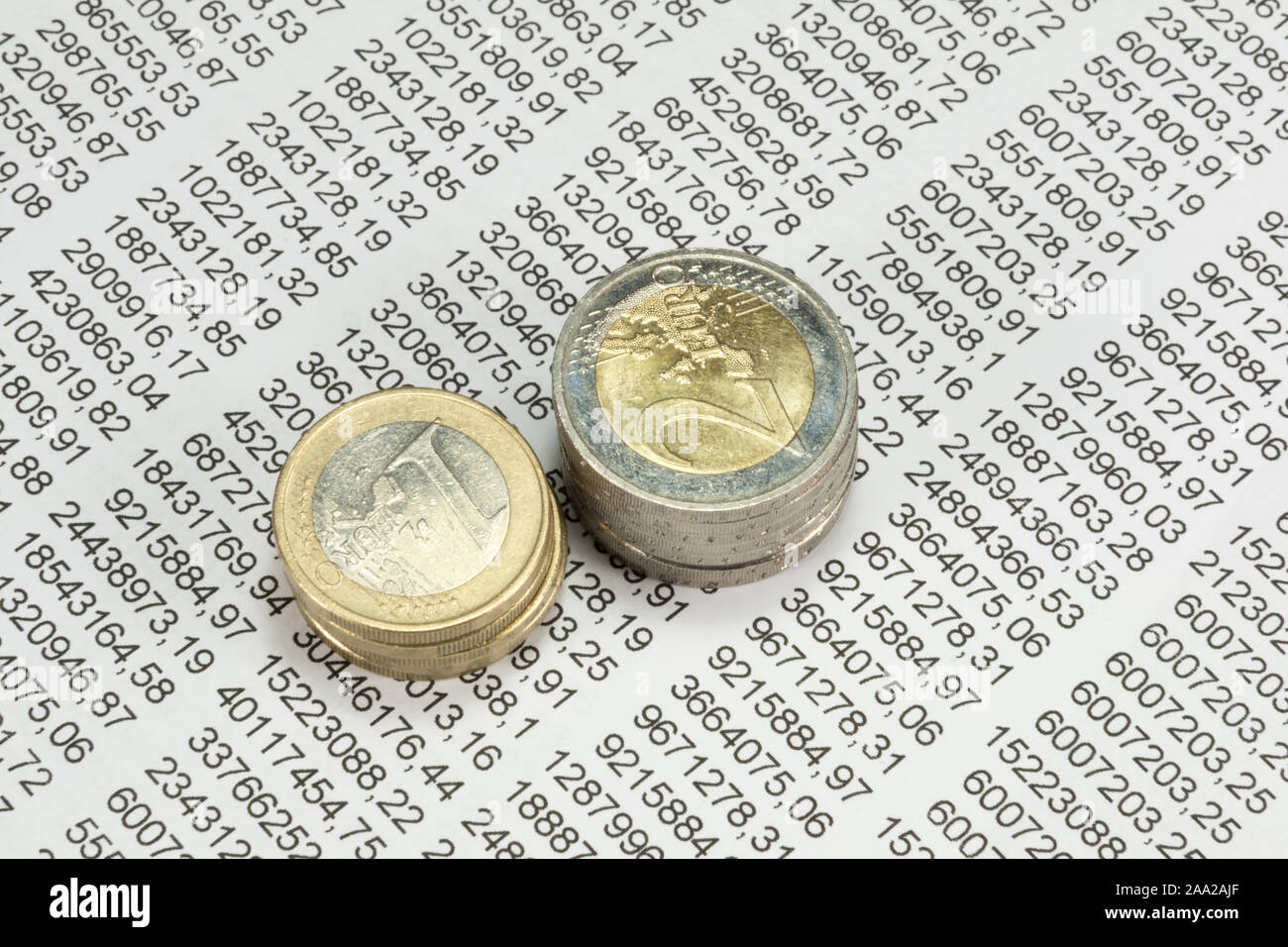 Euro coins and spreadsheet Stock Photo - Alamy