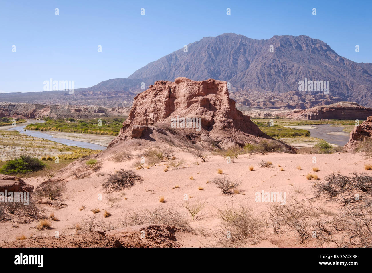 Scenic view of typical geological formations at the Quebrada de las Conchas with the River Las Conchas in the background, Cafayate, Argentina Stock Photo