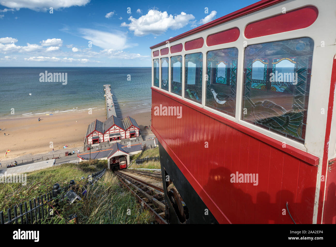 View from the top of the Saltburn funicular railway, one of the world's oldest water-powered cliff lifts, towards the Victorian Pier, North Yorkshire. Stock Photo