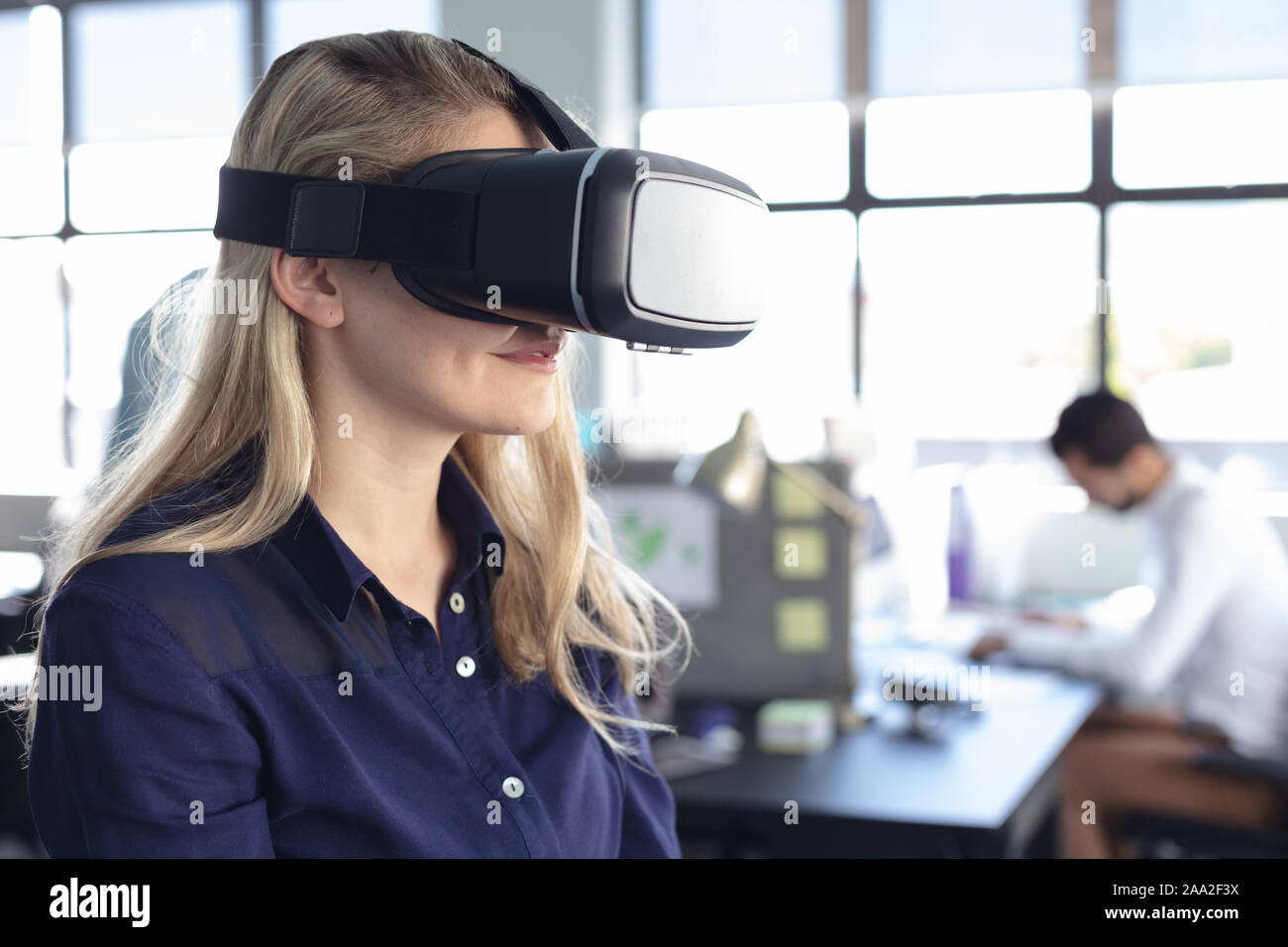 Business professional at work using VR Stock Photo