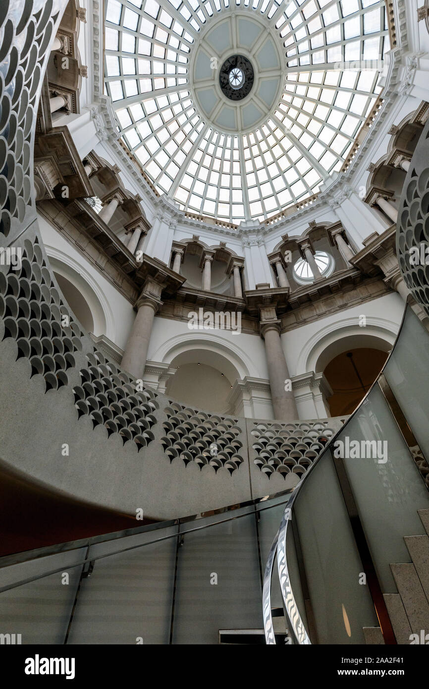 The glass domed atrium and elegant spiral staircase at Tate Britain, Millbank, London, UK Stock Photo