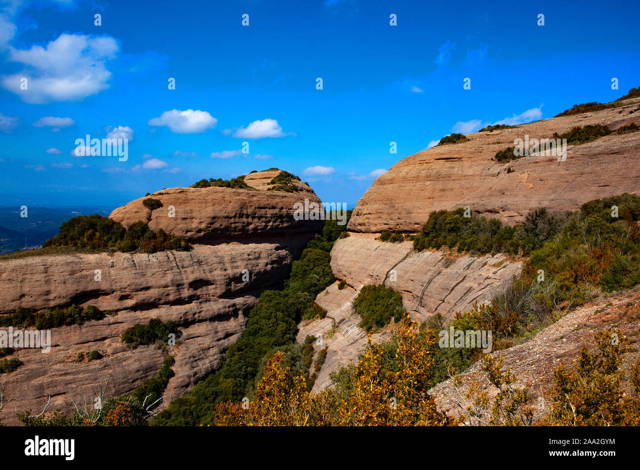 Rock formations on the the 1056 metre high mountain of Montcau, in the Parc Natural Sant Llorenc del Munt massif, near Barcelona, Catalonia. Stock Photo