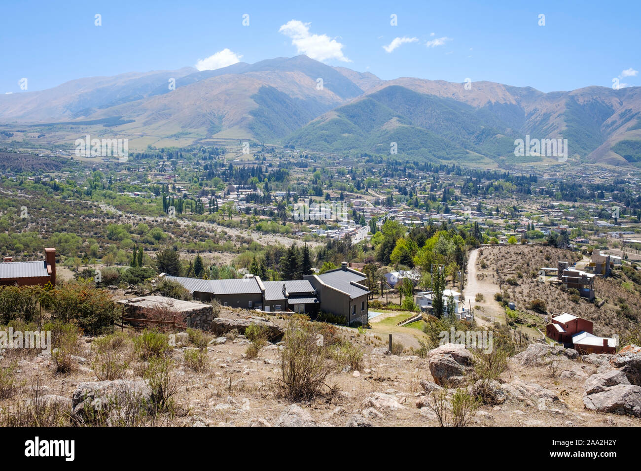 Houses overlooking the valley and town of Tafi del Valle from the near mountain hillside, Argentina Stock Photo