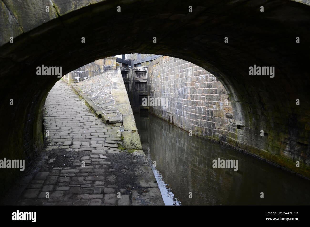 canal bridge and toe path,  bridge crossing Huddersfield narrow canal Stock Photo