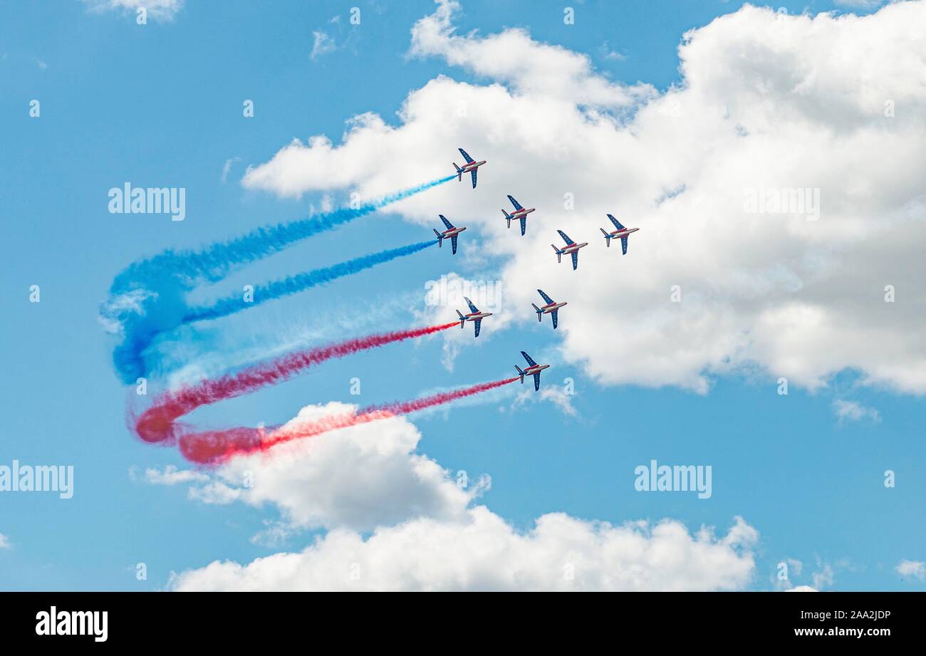 Aerobatics with French flag, Patrouille de France, Aerobatics squadron of the French Air Force, Airplane Alpha Jet in French colours, Airshow, Paris Stock Photo
