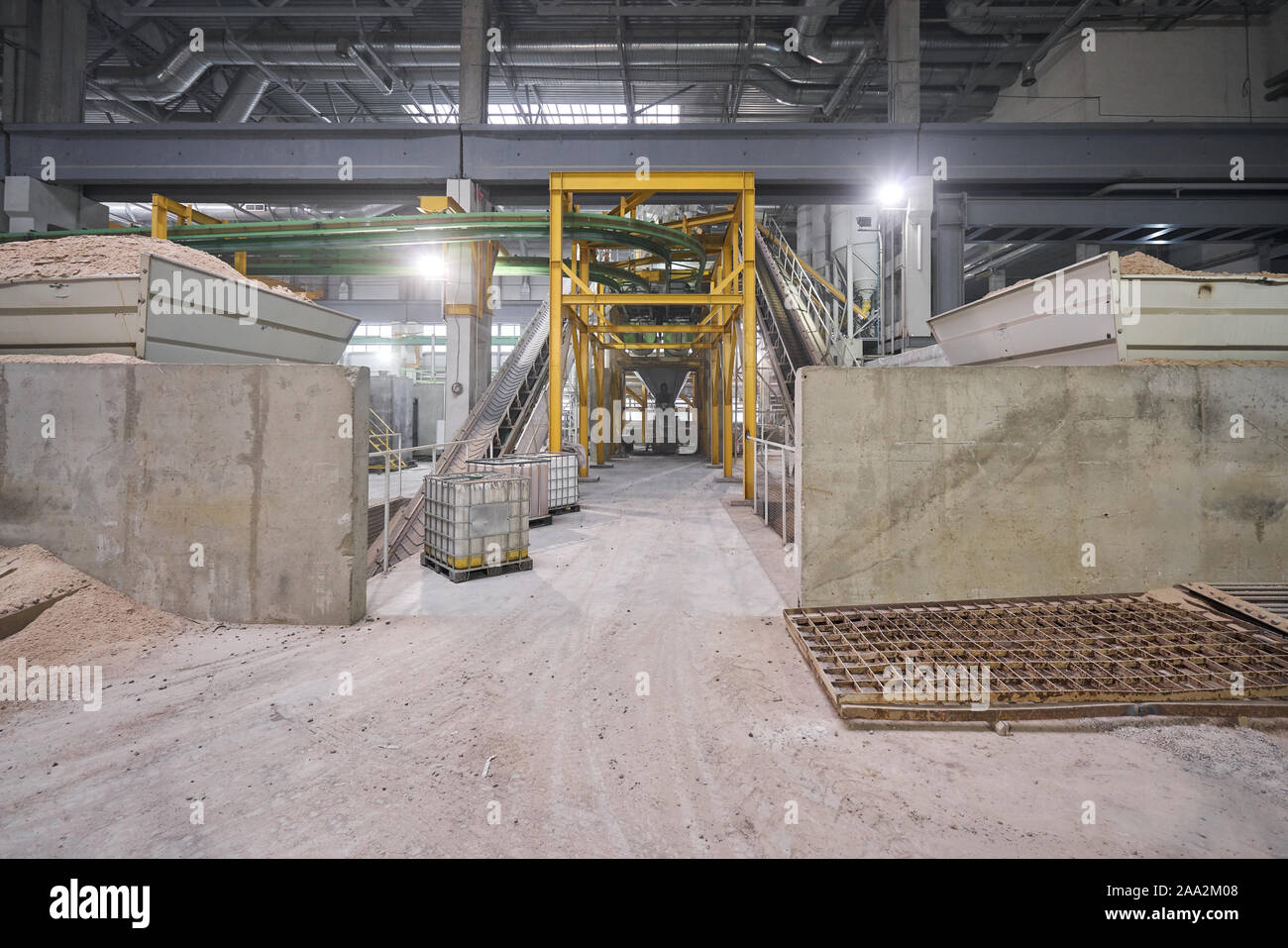 Large industrial mixer, for mixing ingredients into liquid cement.. Workers in the of