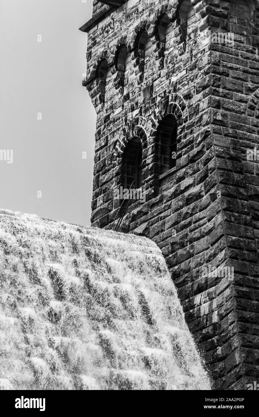 Overflow water next to the Tower on Derwent Dam Stock Photo