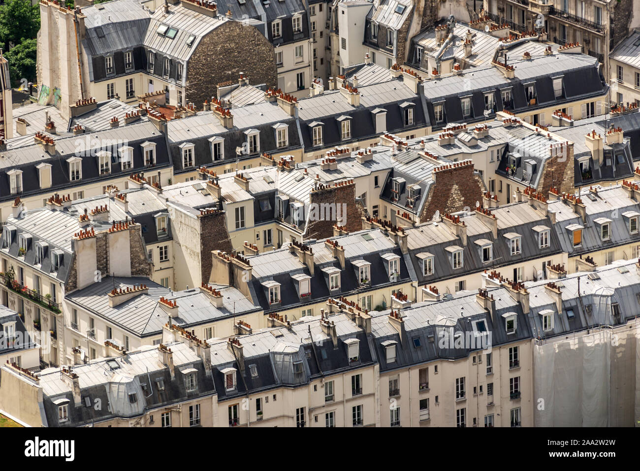 Aerial view of haussmanian buildings, traditional zinc roofs and chimneys in Paris, France Stock Photo