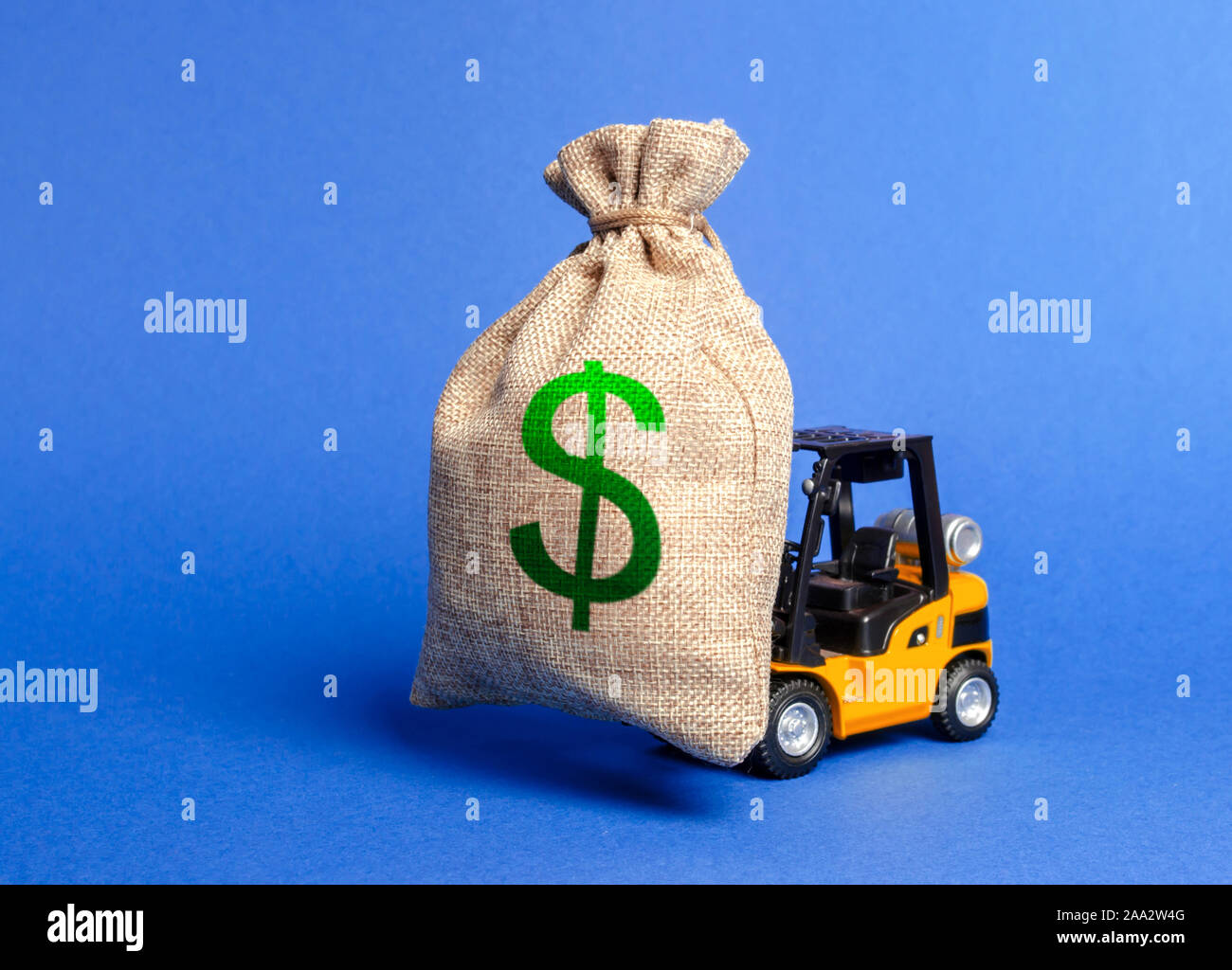 Forklift carries a huge money bag with the symbol of US dollar. Budget and taxpayer funds. Investment and capital migration. Superprofits. Win a tende Stock Photo