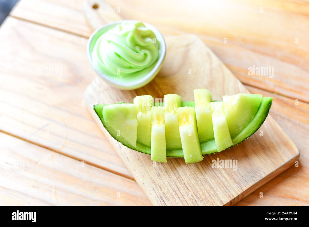 Sliced Japanese Green Melon with Green Melon Ice Cream Stock Photo
