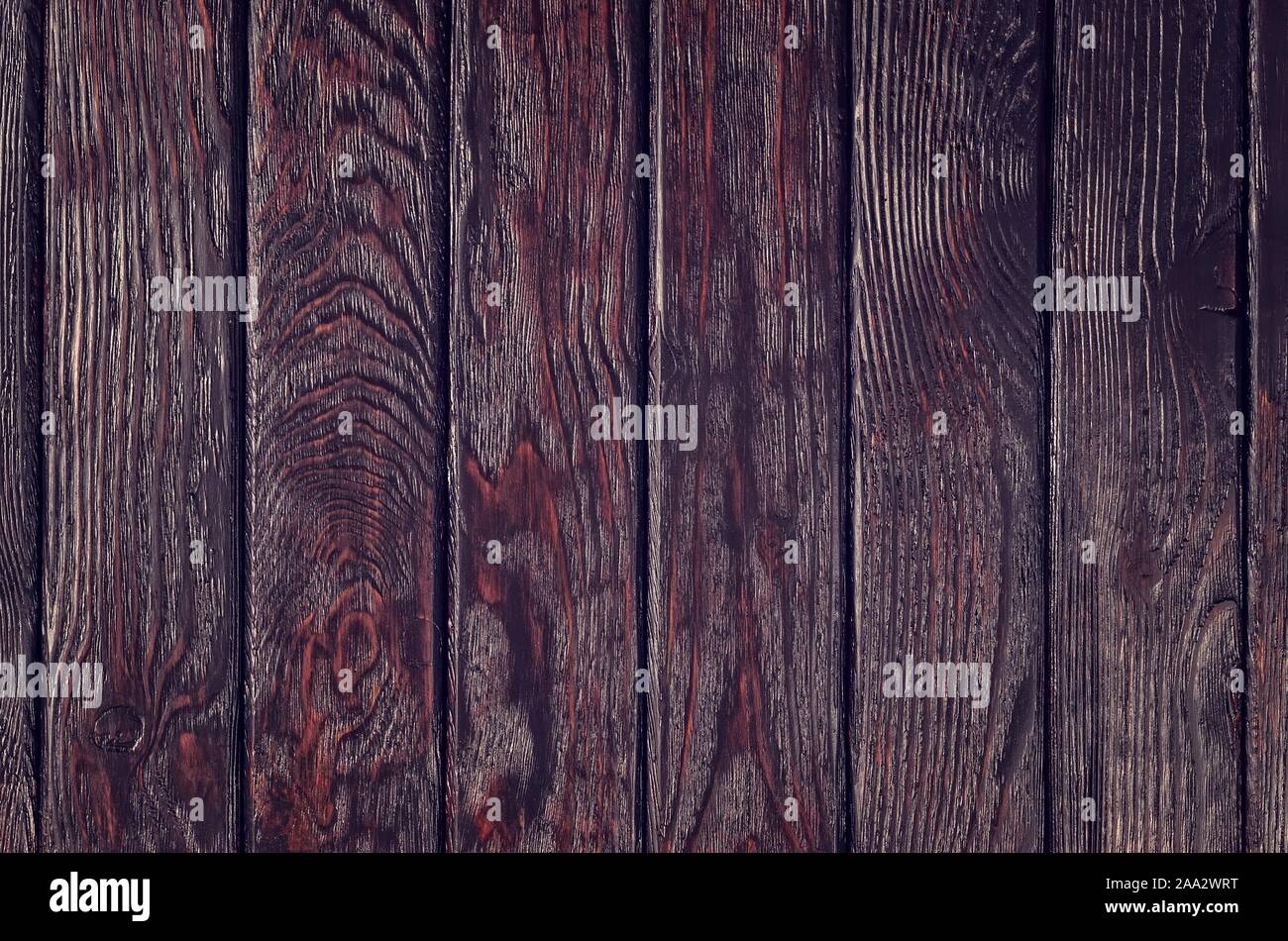 Wooden background texture. Creatively painted dark brown boards. Stock Photo