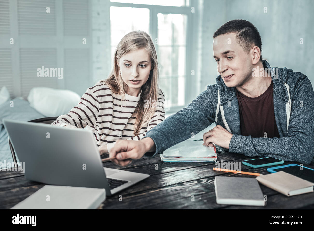 Nice young students preparing together for exam Stock Photo