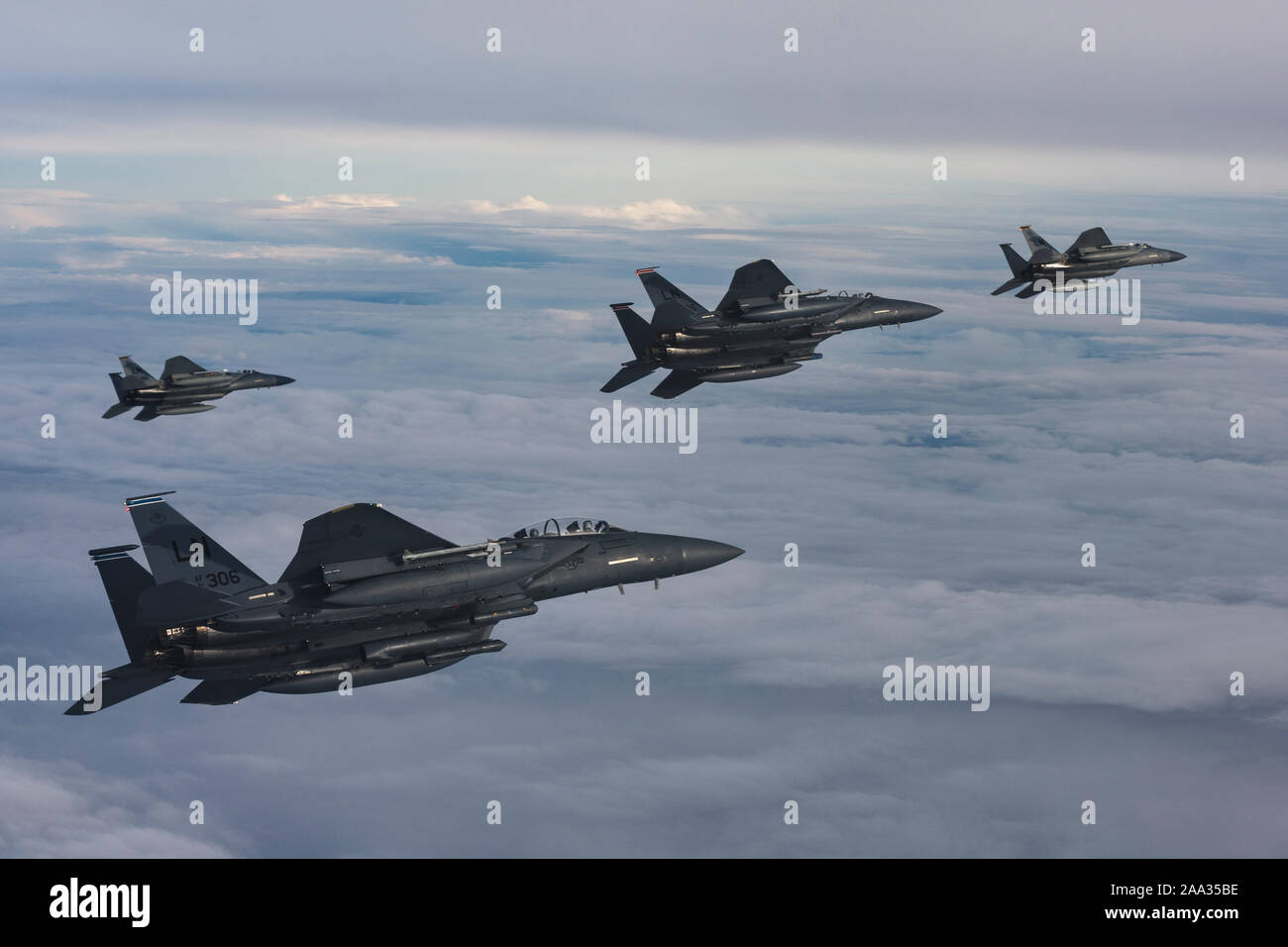 U.S. Air Force F-15C Eagles and F-15E Strike Eagles assigned to the 48th Fighter Wing conduct aerial operations in support of exercise Point Blank 19-8, over the North Sea, Nov. 14, 2019. The purpose of Point Blank is to exercise large force capabilities that incorporate current and future wartime scenarios. This iteration is especially unique in that it features special operations forces and the ‘Iron Triad’. (U.S. Air Force photo/ Staff. Sgt. Rachel Maxwell) Stock Photo