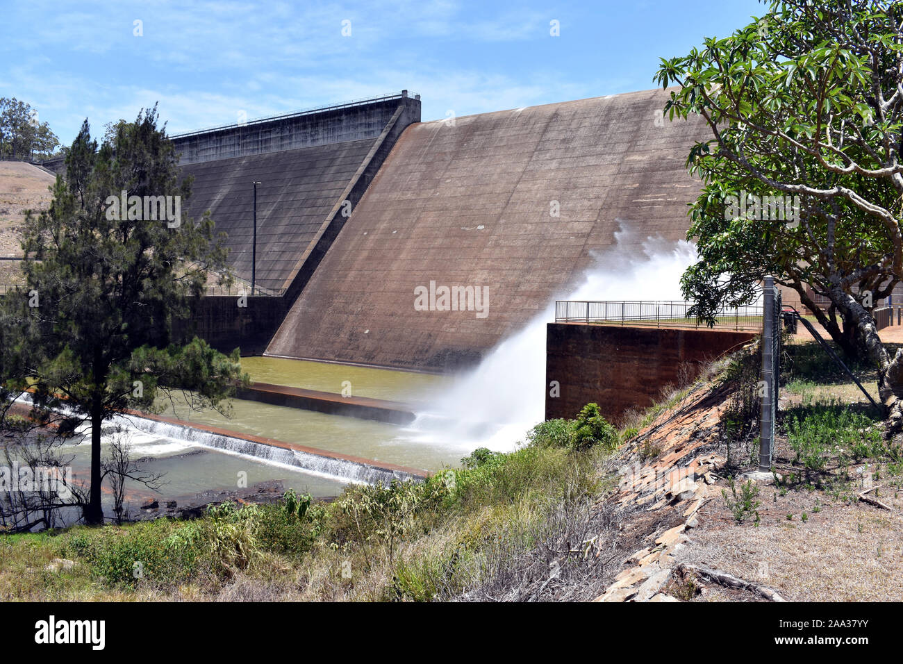 A general view of the Tinaroo Falls Dam showing water release for irrigation downstream Stock Photo