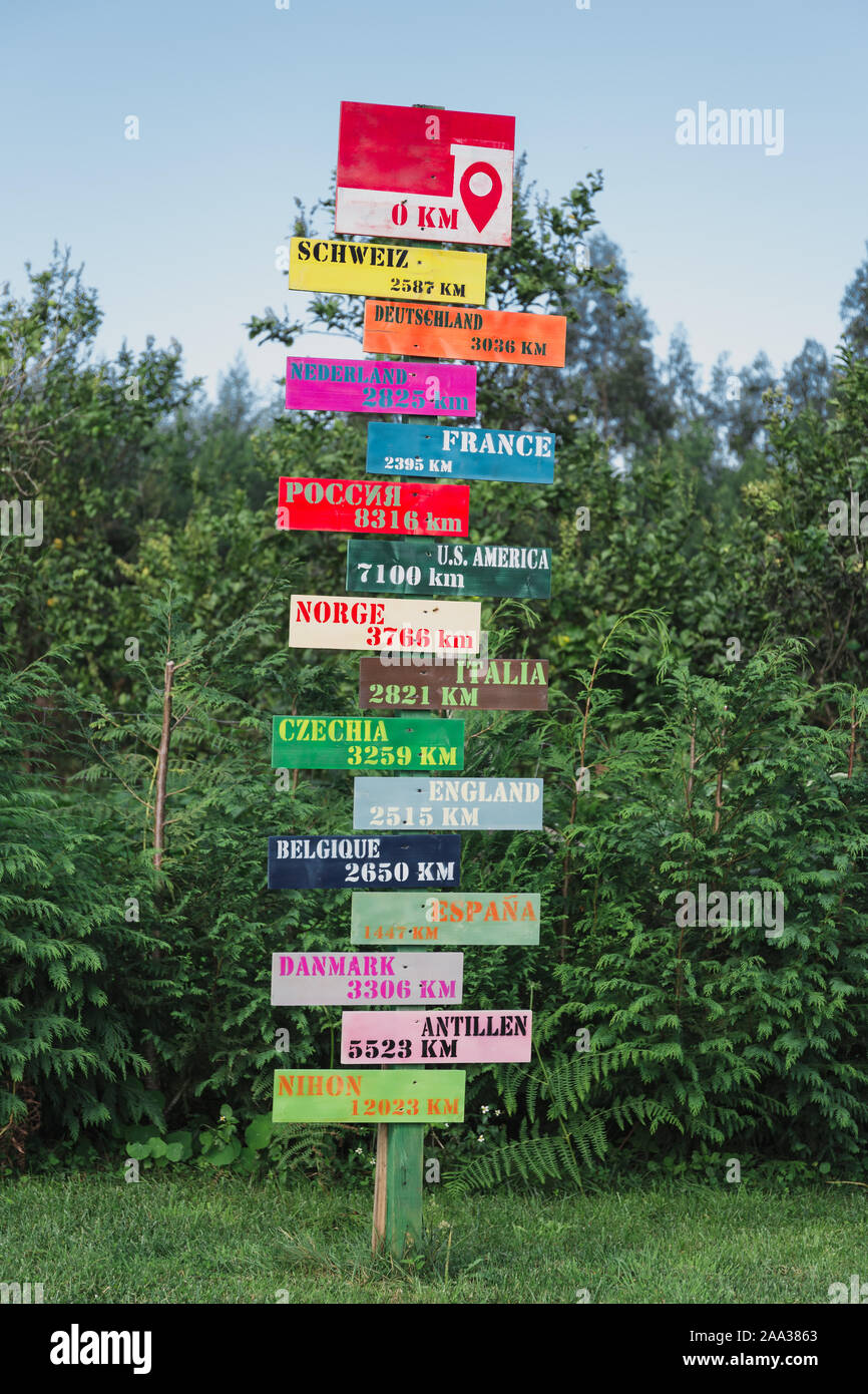 Rural tourism sign post with name of countries direction Stock Photo
