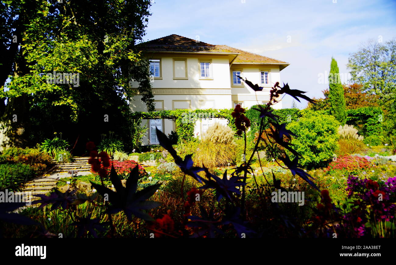 well maintained old villa with beautiful garden in the foreground 2 Stock Photo