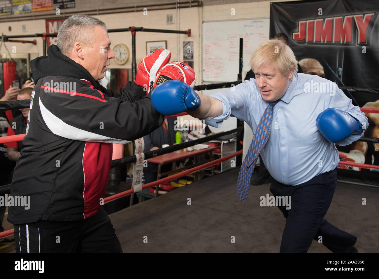 Prime Minister Boris Johnson spars with boxing coach, Steve Egan during a visit to Jimmy Egan's Boxing Academy at Wythenshawe, while on the campaign trail ahead of the General Election. PA Photo. Picture date: Tuesday November 19, 2019. See PA story POLITICS Election. Photo credit should read: Stefan Rousseau/PA Wire Stock Photo