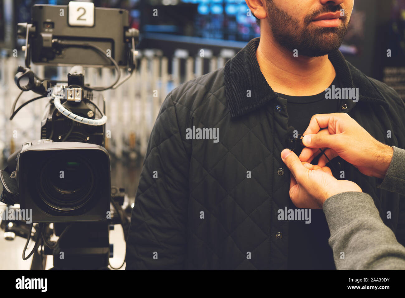 Television video camera recording interview in broadcast news studio