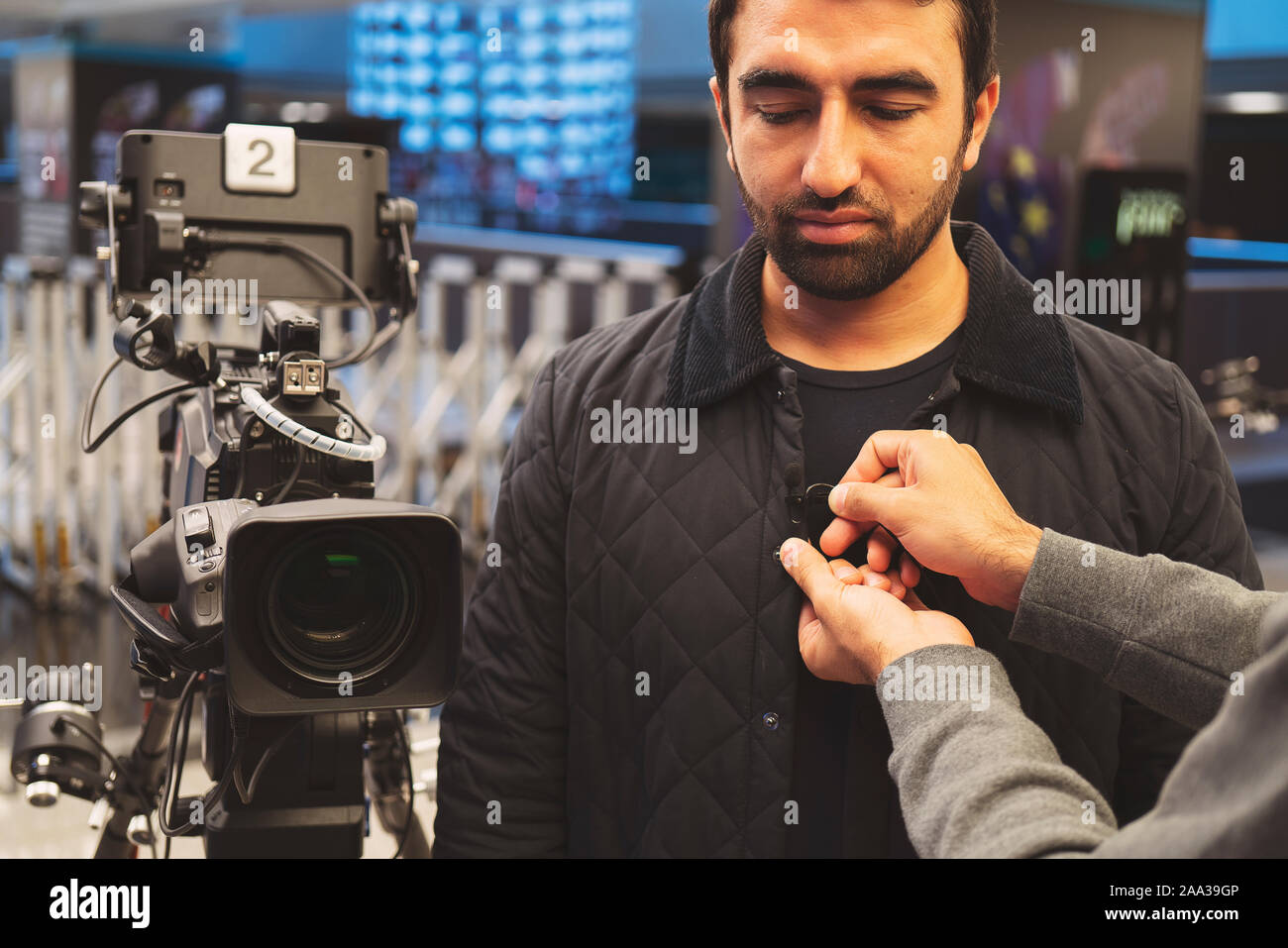 Television video camera recording interview in broadcast news studio