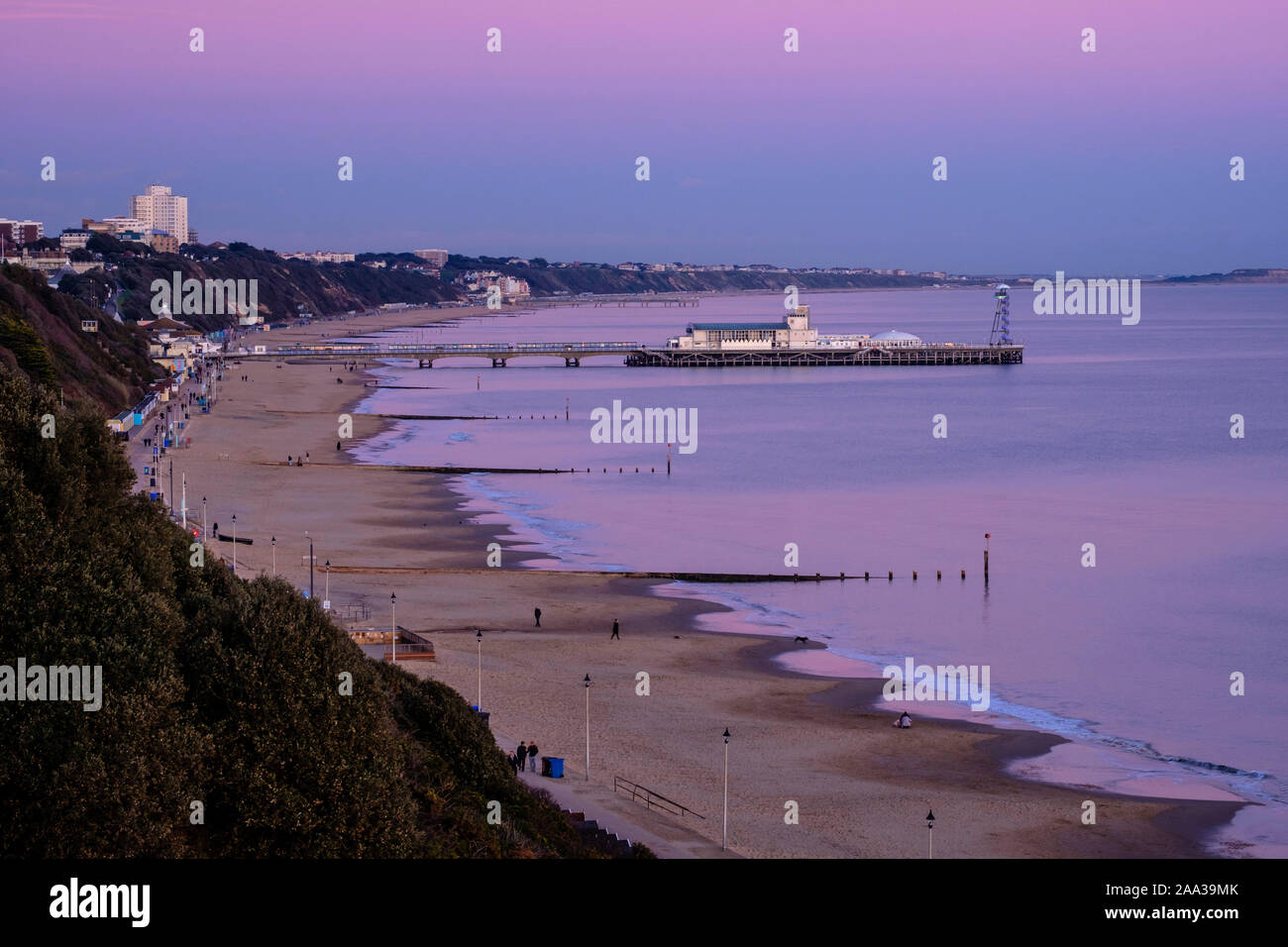 Bournemouth Pier, Beach and Promenade at Dusk, Poole Bay, Dorset, England, UK. Stock Photo