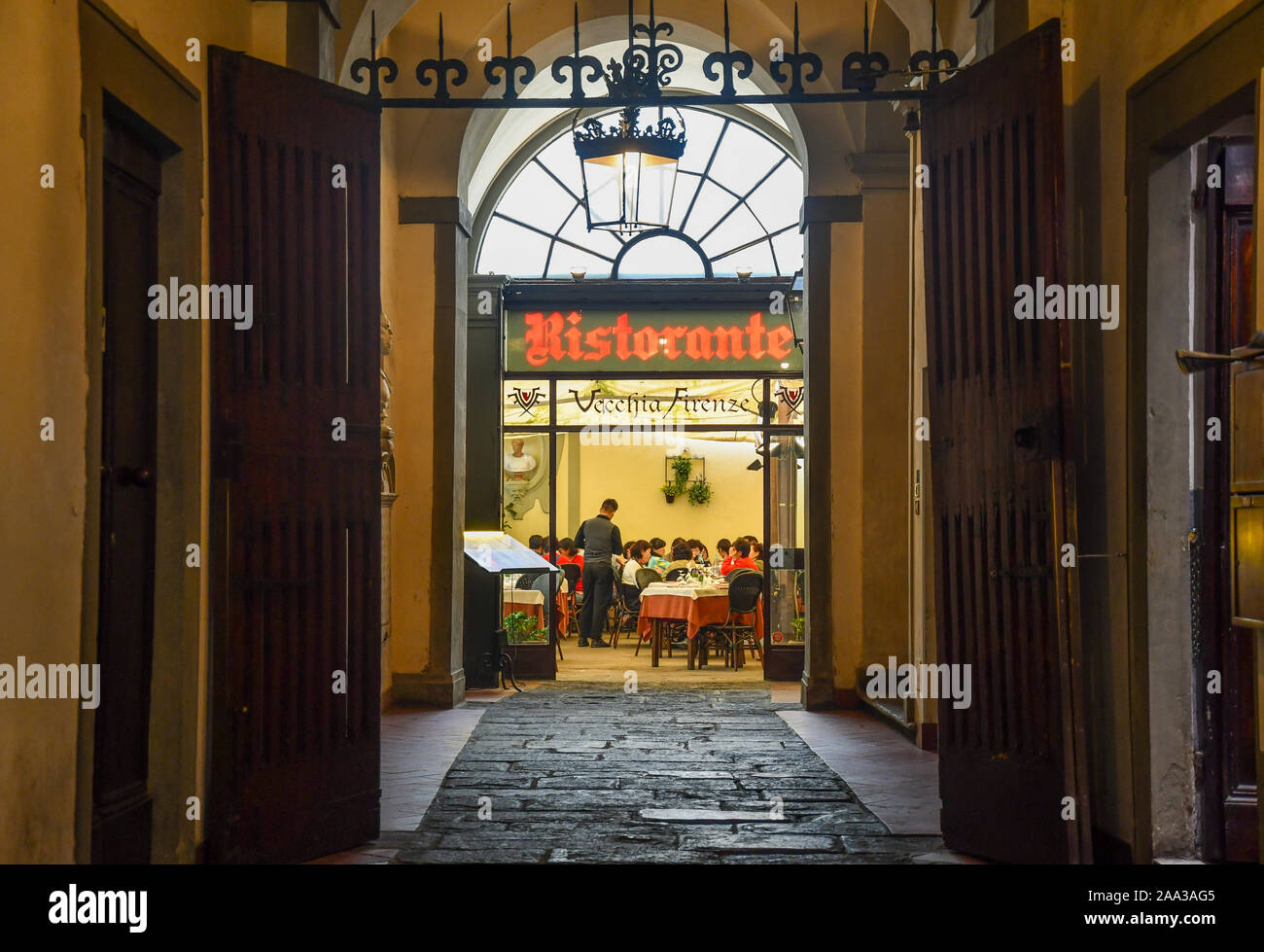 Entrance of Vecchia Firenze restaurant, located at the ground floor of Palazzo Valori Altoviti, knows as Palazzo dei Visacci, Florence, Tuscany, Italy Stock Photo