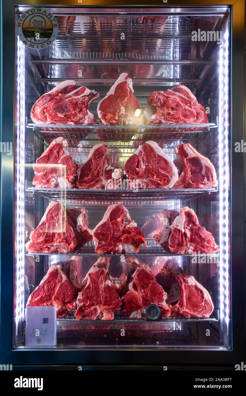 Close-up of a display fridge with raw meat cuts used to cook Florentine  steaks, a typical Tuscan dish, Florence, Tuscany, Italy Stock Photo - Alamy