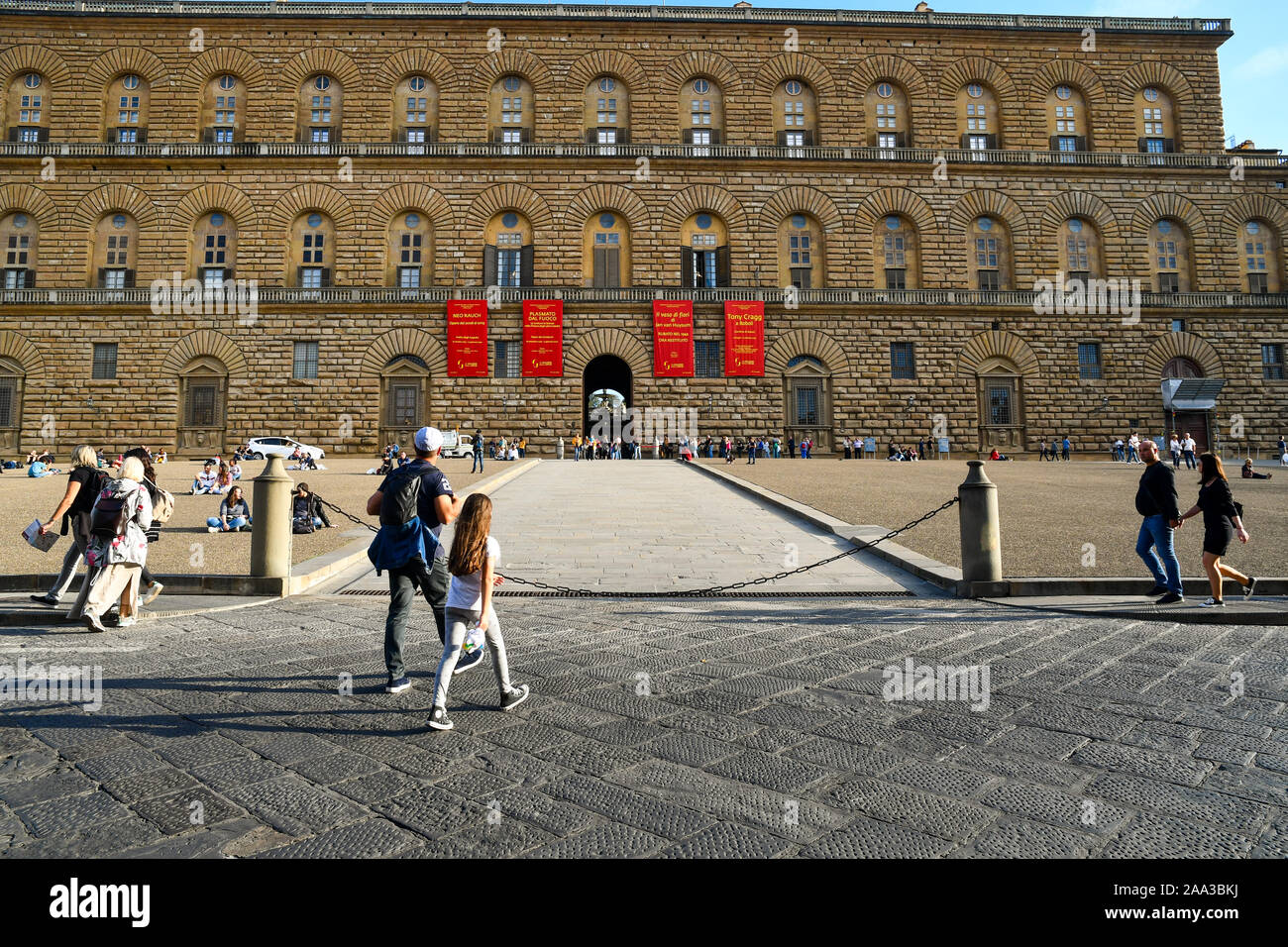 Façade of Palazzo Pitti, a famous museum complex in the historic centre of Florence, Unesco World Heritage Site, with tourists, Tuscany, Italy Stock Photo