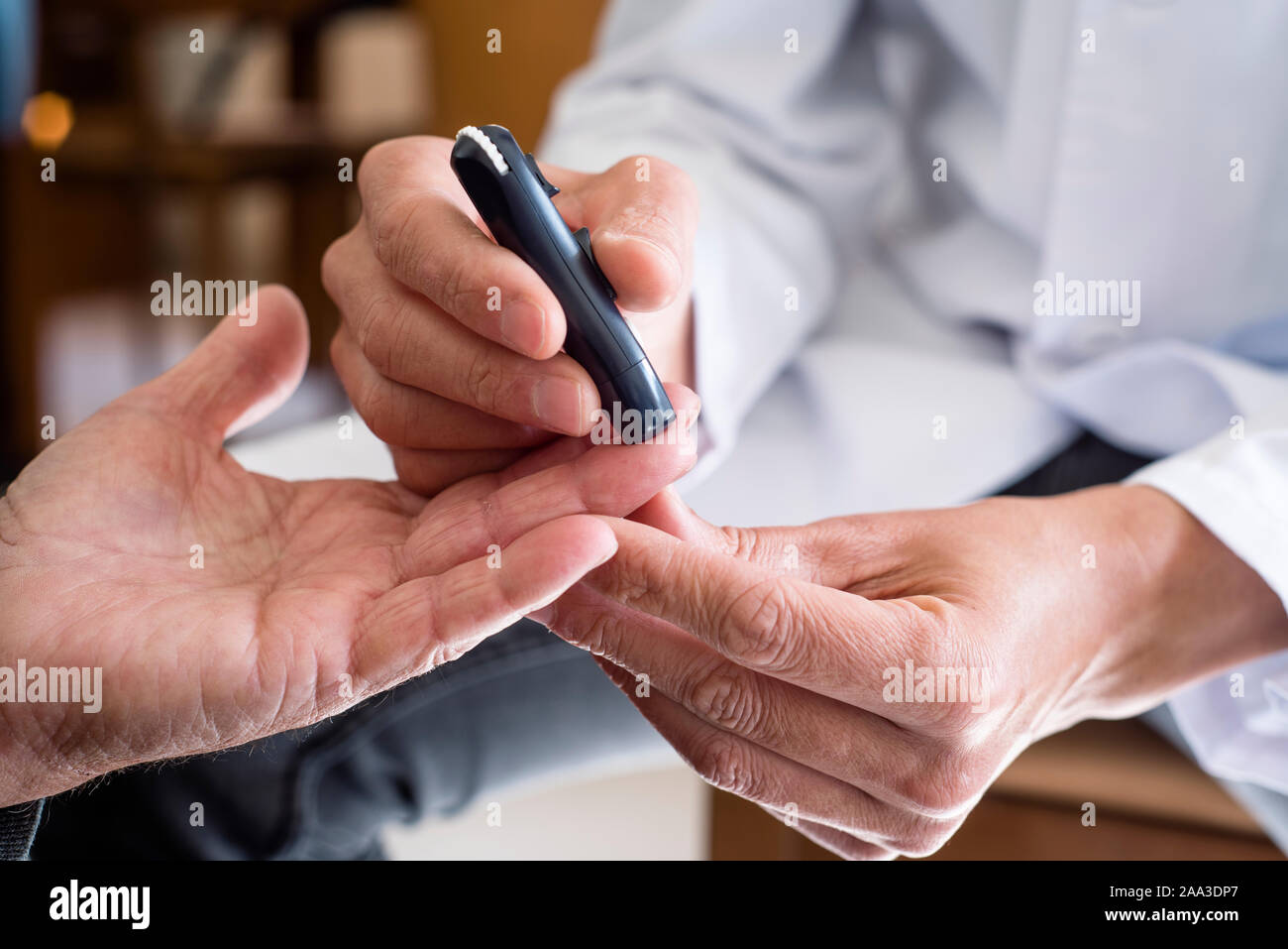 Blood glucose monitoring fingerstick hi-res stock photography and ...