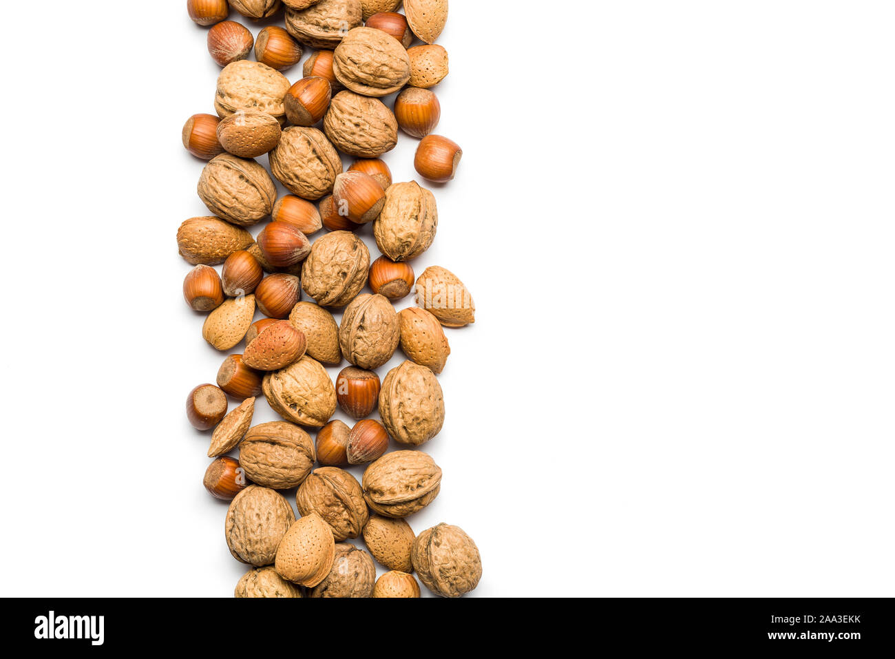 top view of mix of nuts scattered on white background with copy space Stock Photo