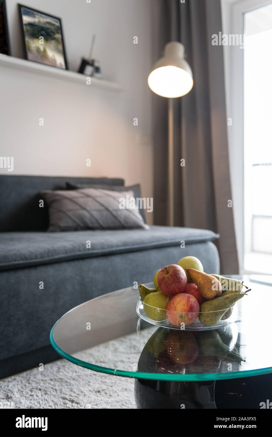 Sofa and glass table in modern living room Stock Photo - Alamy