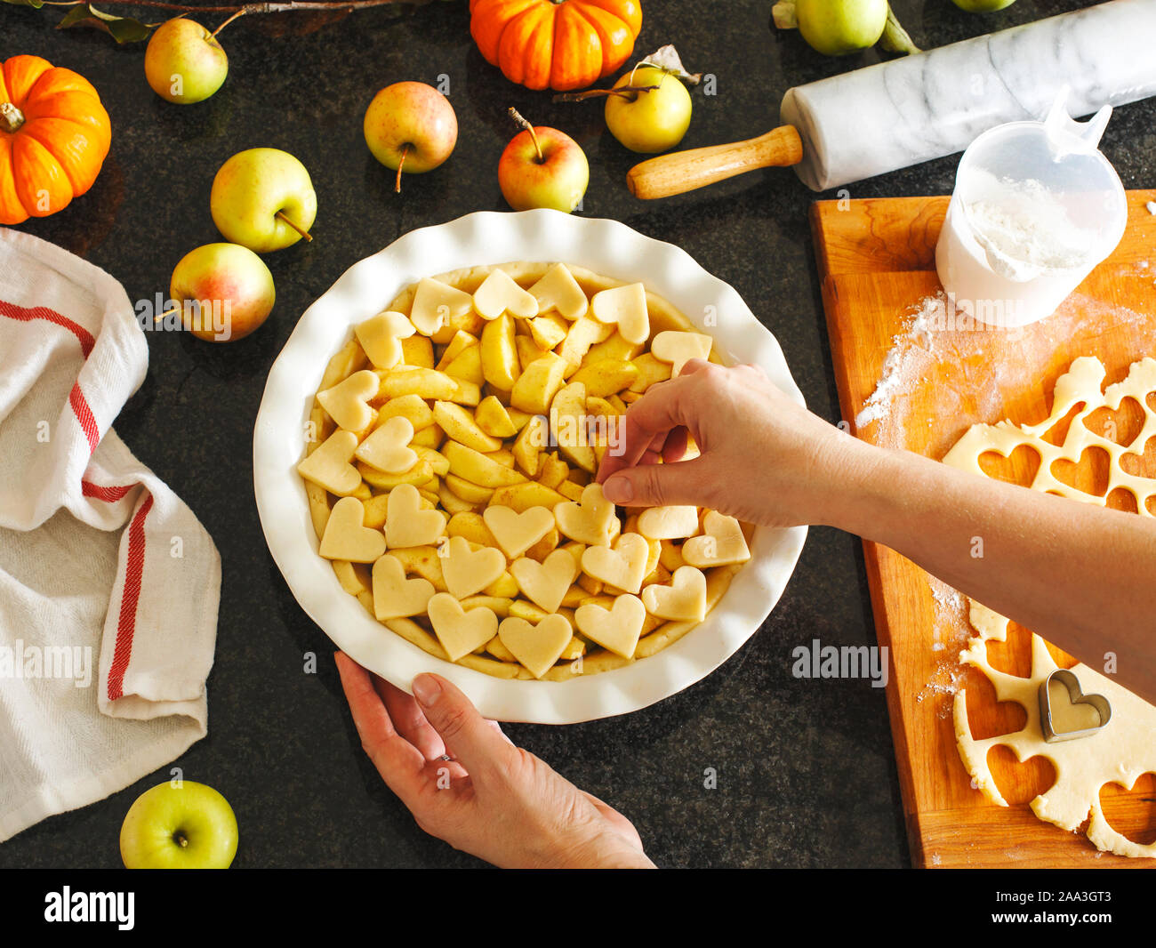 Woman Preparing traditional apple pie Stock Photo