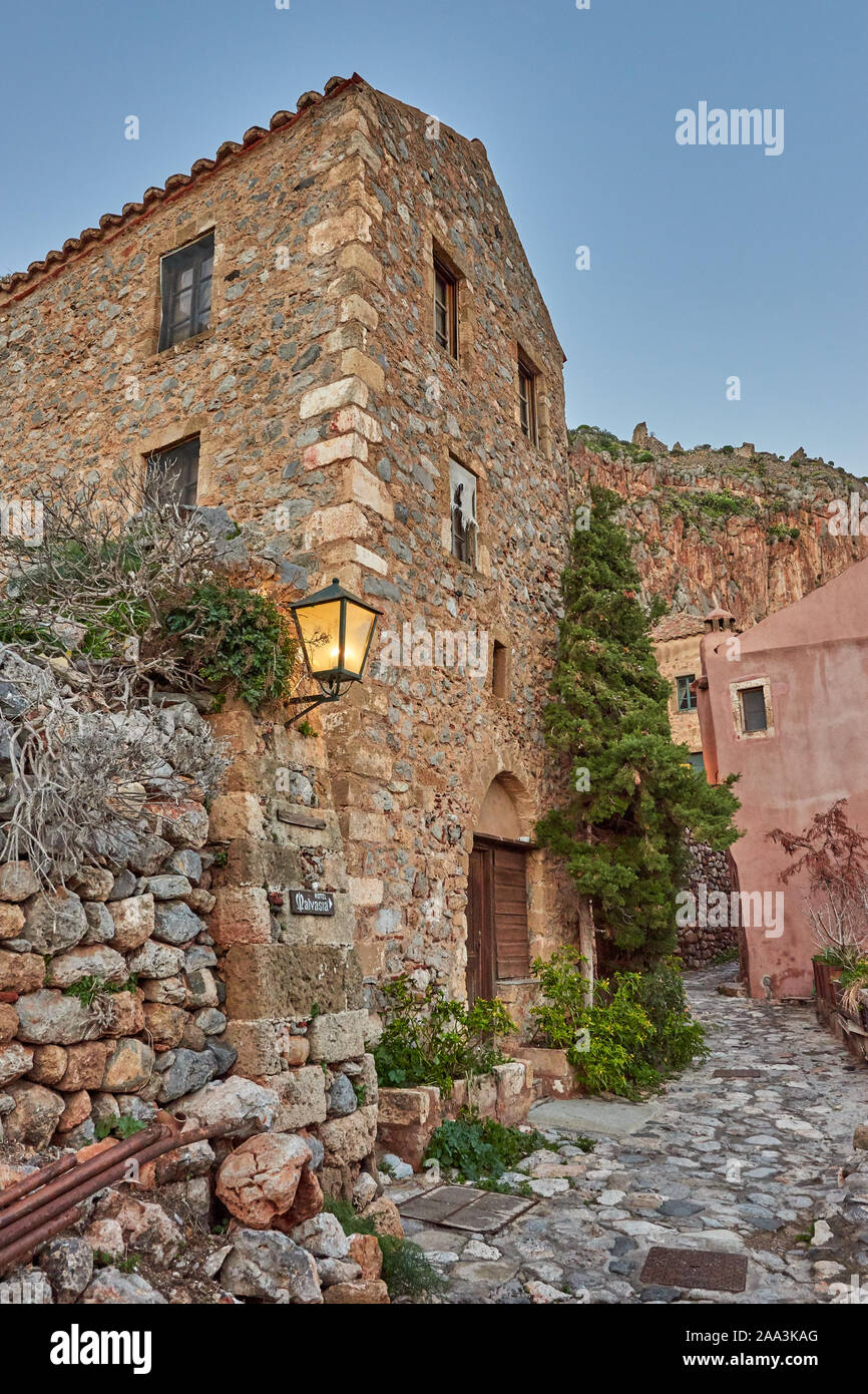 Stone alley into the picturesque castle town of Monemvasia during winter. Architectural stone buildings and beautiful narrow paved streets Stock Photo