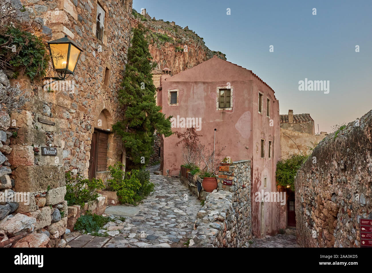 Stone alley into the picturesque castle town of Monemvasia during winter. Architectural stone buildings and beautiful narrow paved streets Stock Photo