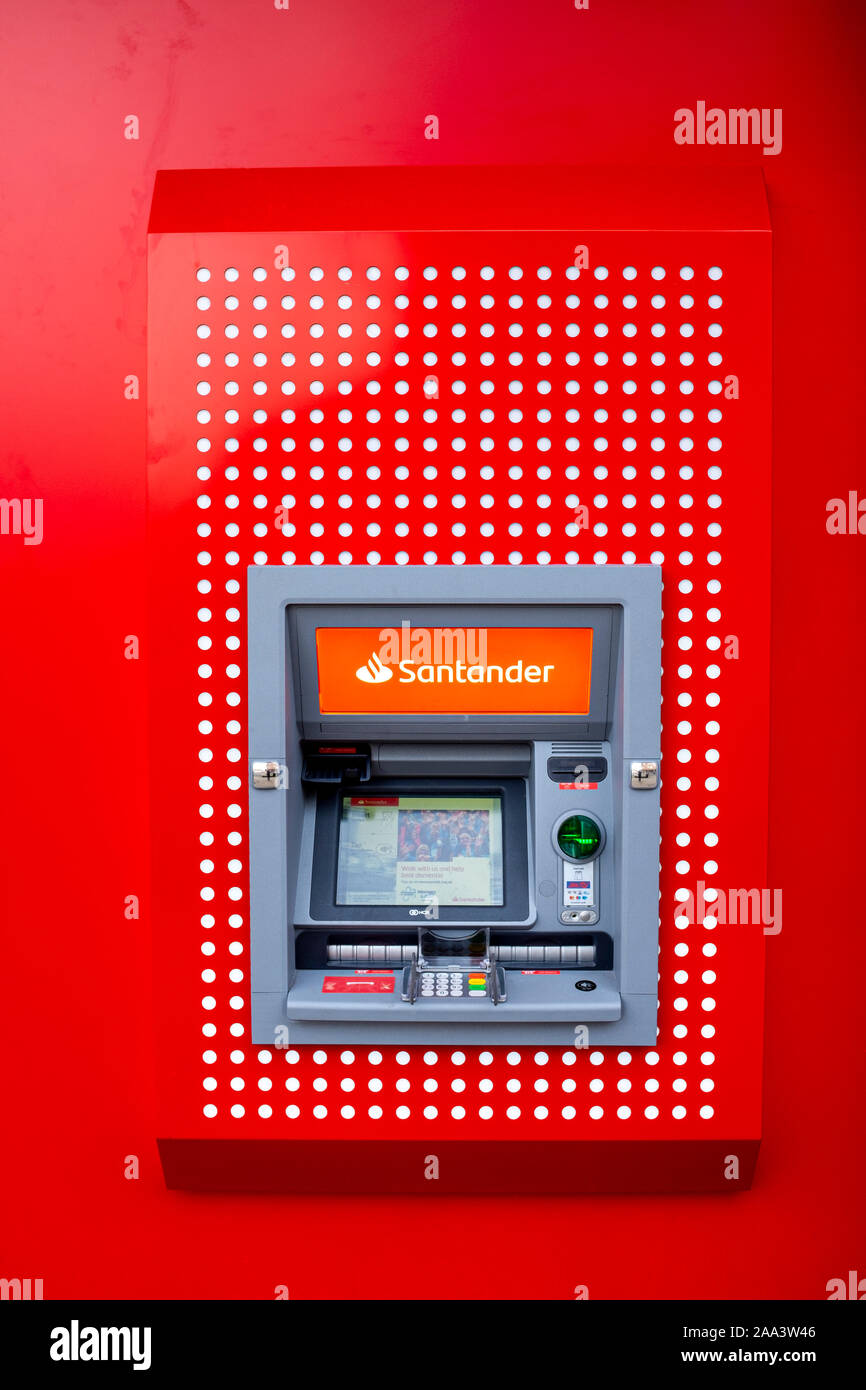 Santander bank cash machine or ATM on outside wall UK Stock Photo