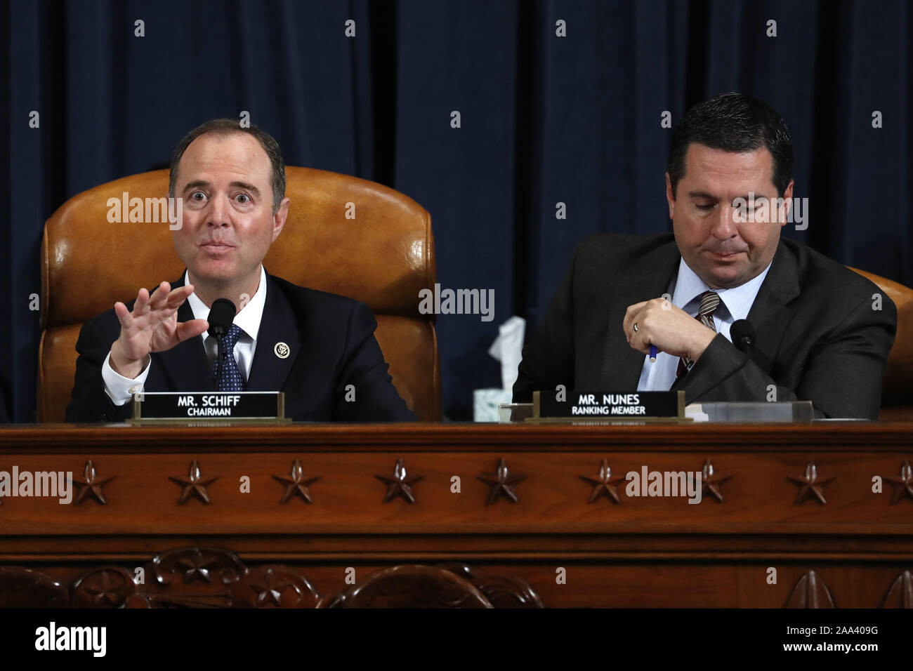 Washington, United States. 19th Nov, 2019. House Intelligence Committee Chairman Adam Schiff, D-Calif., left, and ranking member Rep. Devin Nunes of Calif., speak as Jennifer Williams, an aide to Vice President Mike Pence, and National Security Council aide Lt. Col. Alexander Vindman, testify before the House Intelligence Committee on Capitol Hill in Washington, Tuesday, Nov. 19, 2019, during a public impeachment hearing of President Donald Trump's efforts to tie U.S. aid for Ukraine to investigations of his political opponents. Pool Photo by Jacquelyn Martin/UPI Credit: UPI/Alamy Live News Stock Photo