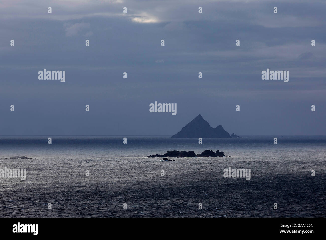View over Skellig islands from distance in stormy weather, Ireland Stock Photo
