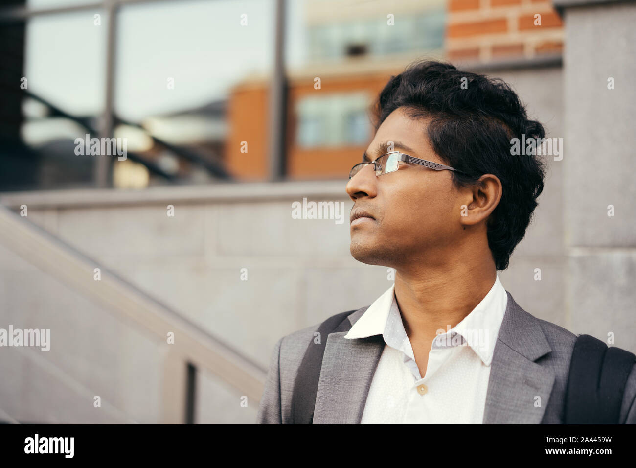 Young handsome Indian man in an office suit and white shirt Stock Photo ...