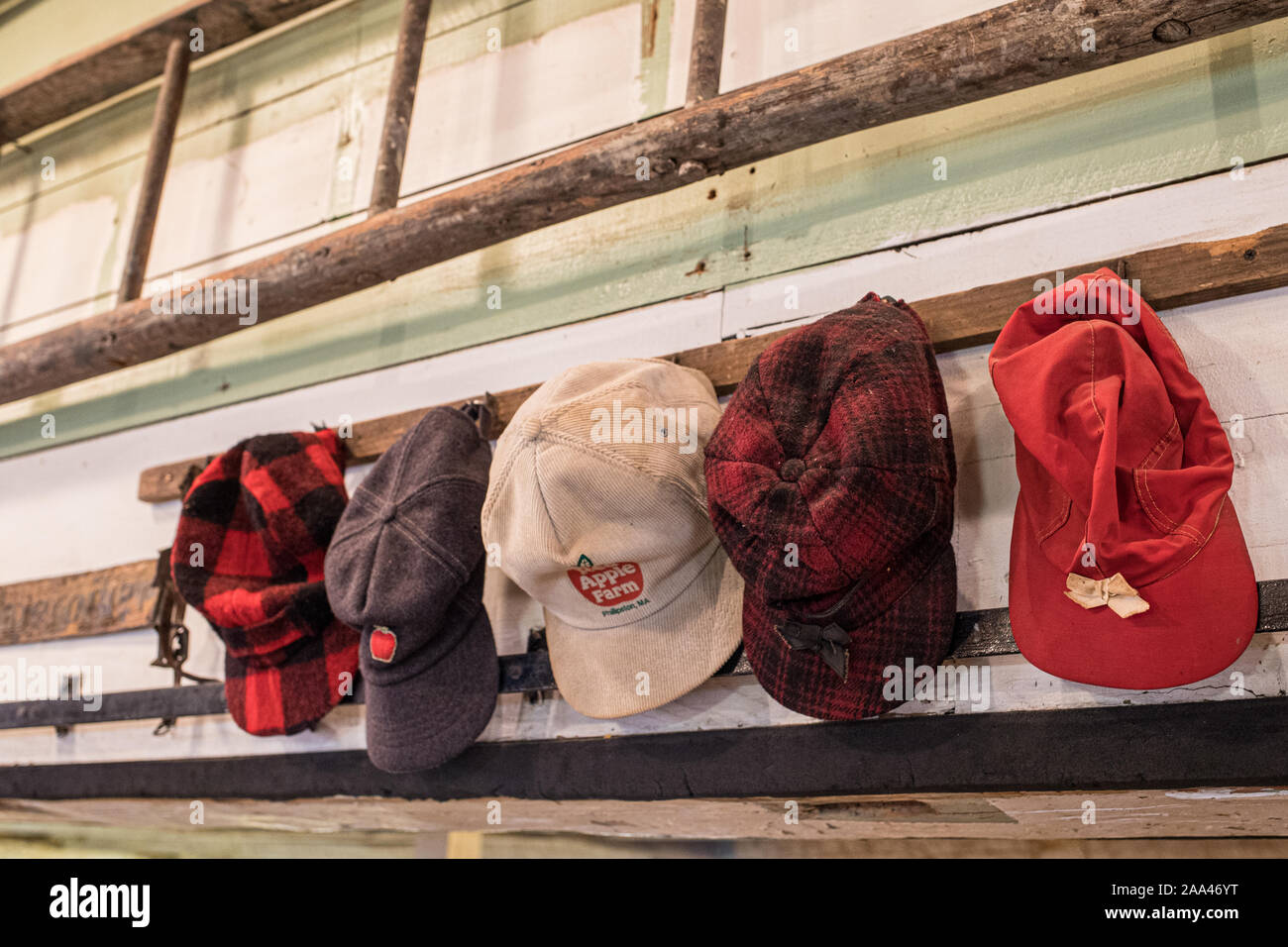 Hats hanging up in a farm store Stock Photo