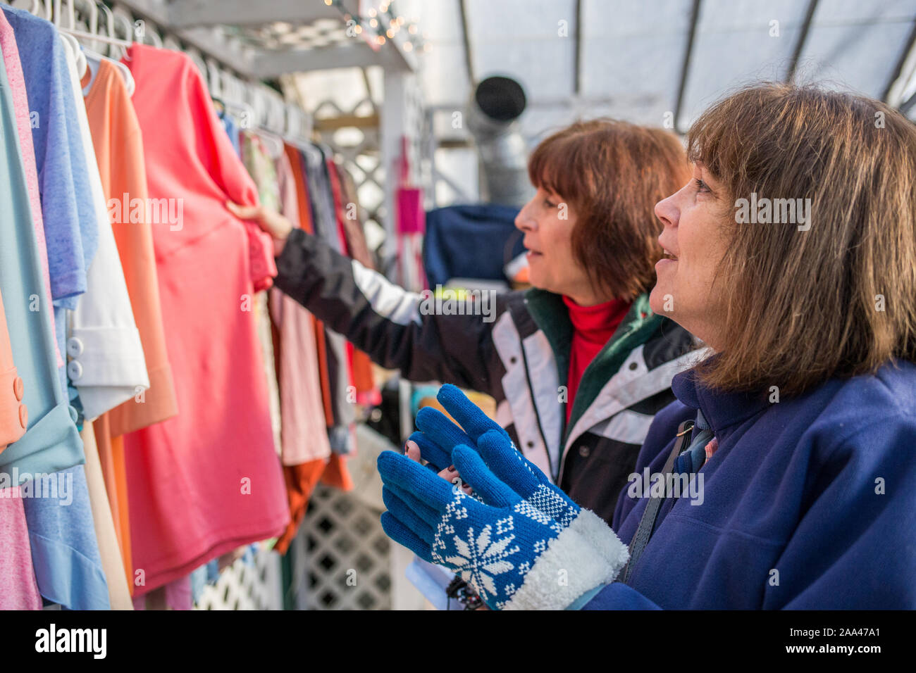 Women shopping at Christmas time for presents in local stores Stock Photo