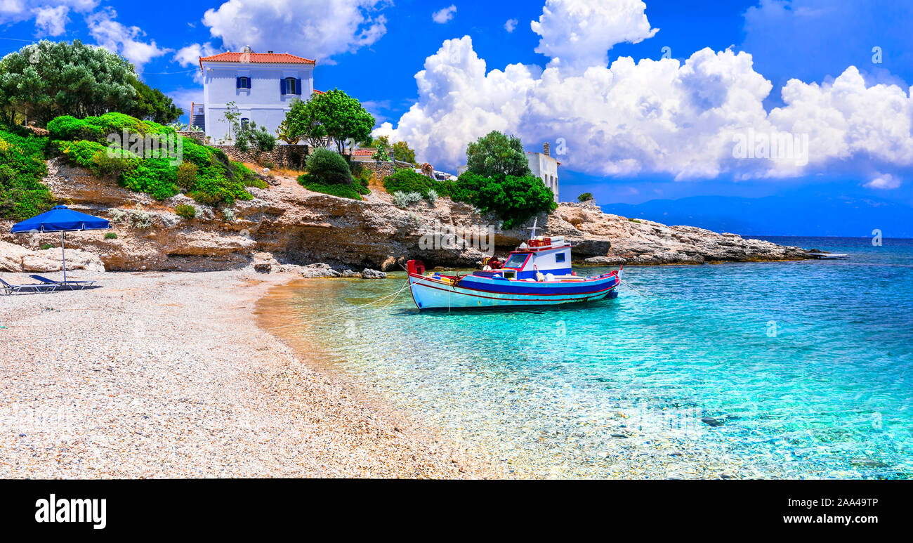 Beautiful Limnionas beach ,view with villa,traditional fishing boat and turquoise sea,Samos island, Greece. Stock Photo
