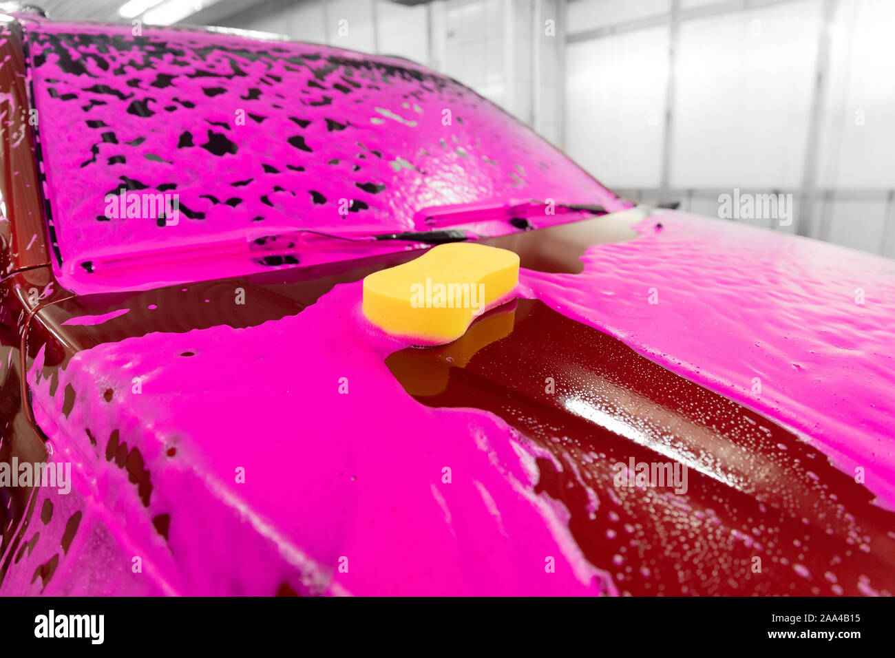 Car washing concept. Red car in foam Stock Photo - Alamy