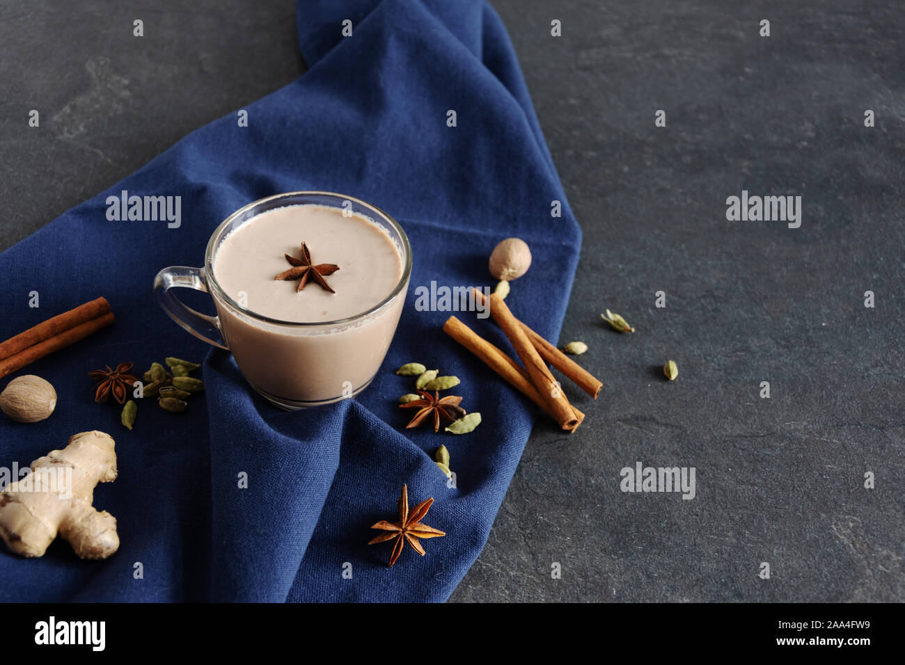 Masala chai made by brewing black tea with aromatic spices and herbs, such as Cinnamon Stick, Thai Cardamom, Ginger, Star Anise, Black Peppercorns, Nu Stock Photo