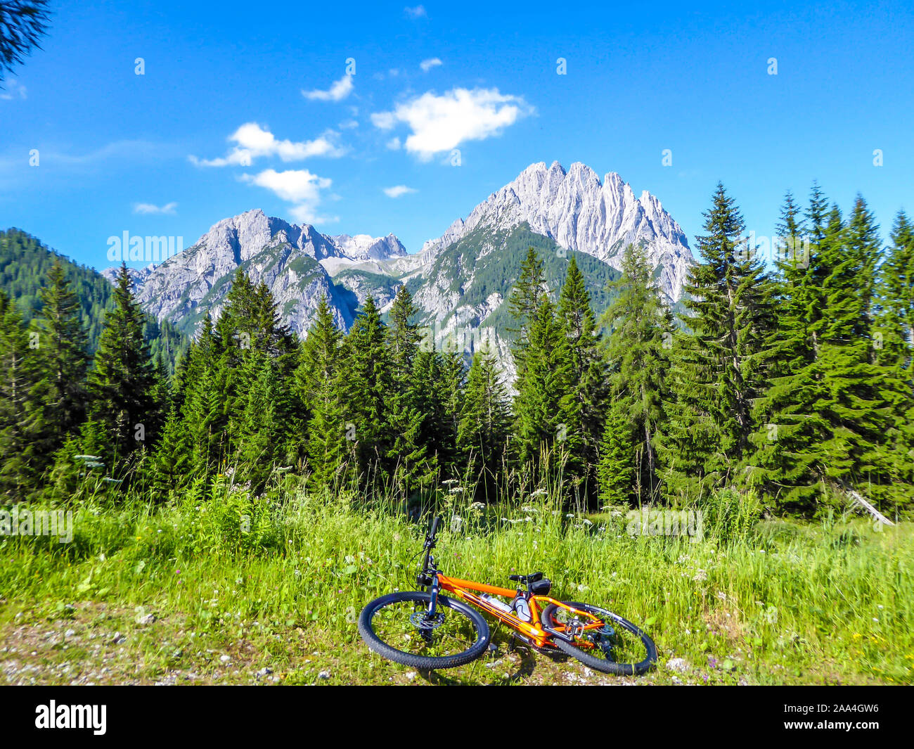 High Alpine mountain biking. A bike is lying on the ground, next to a
